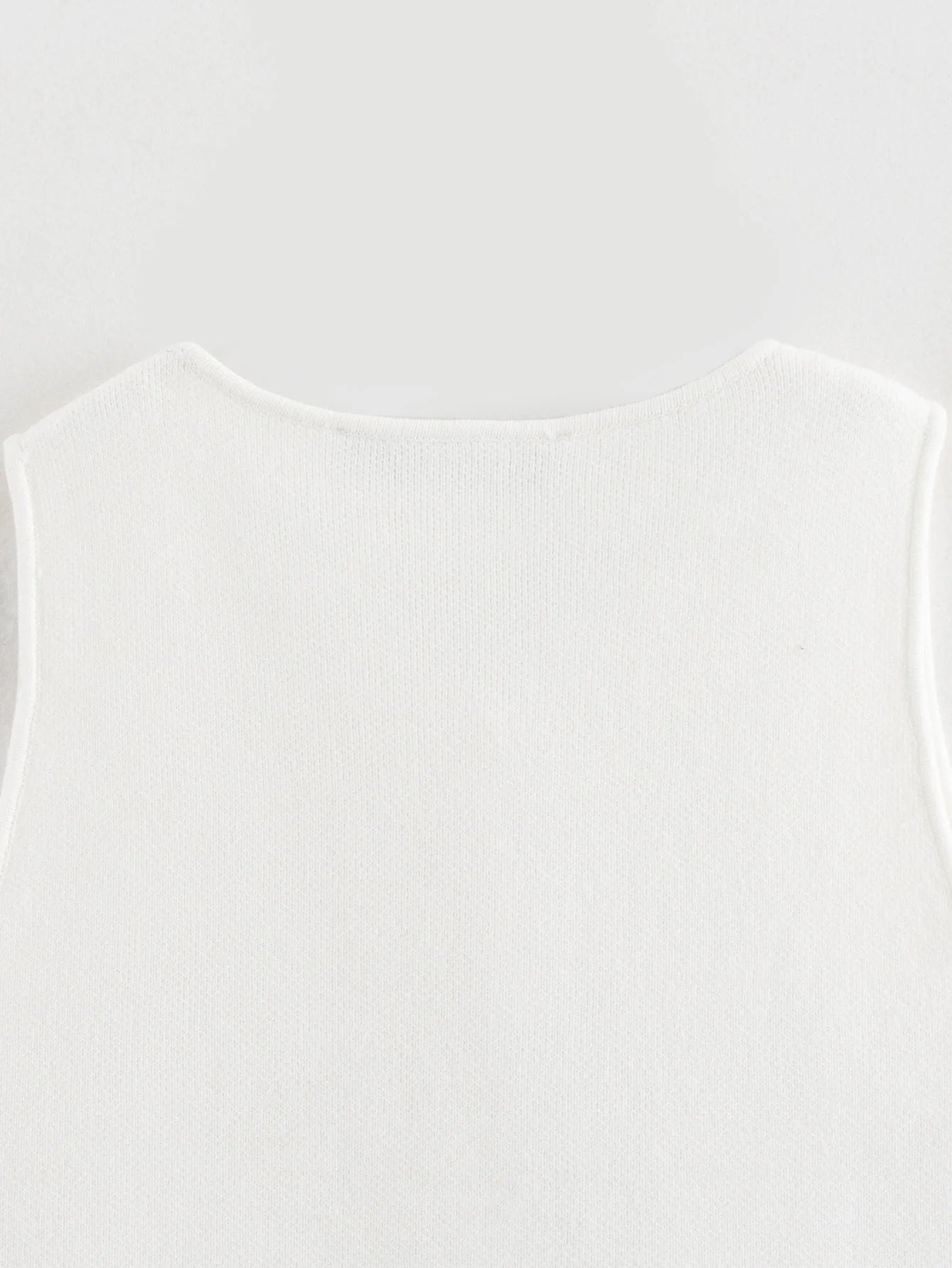 Gilet court en tricot rose sans manches pour femme