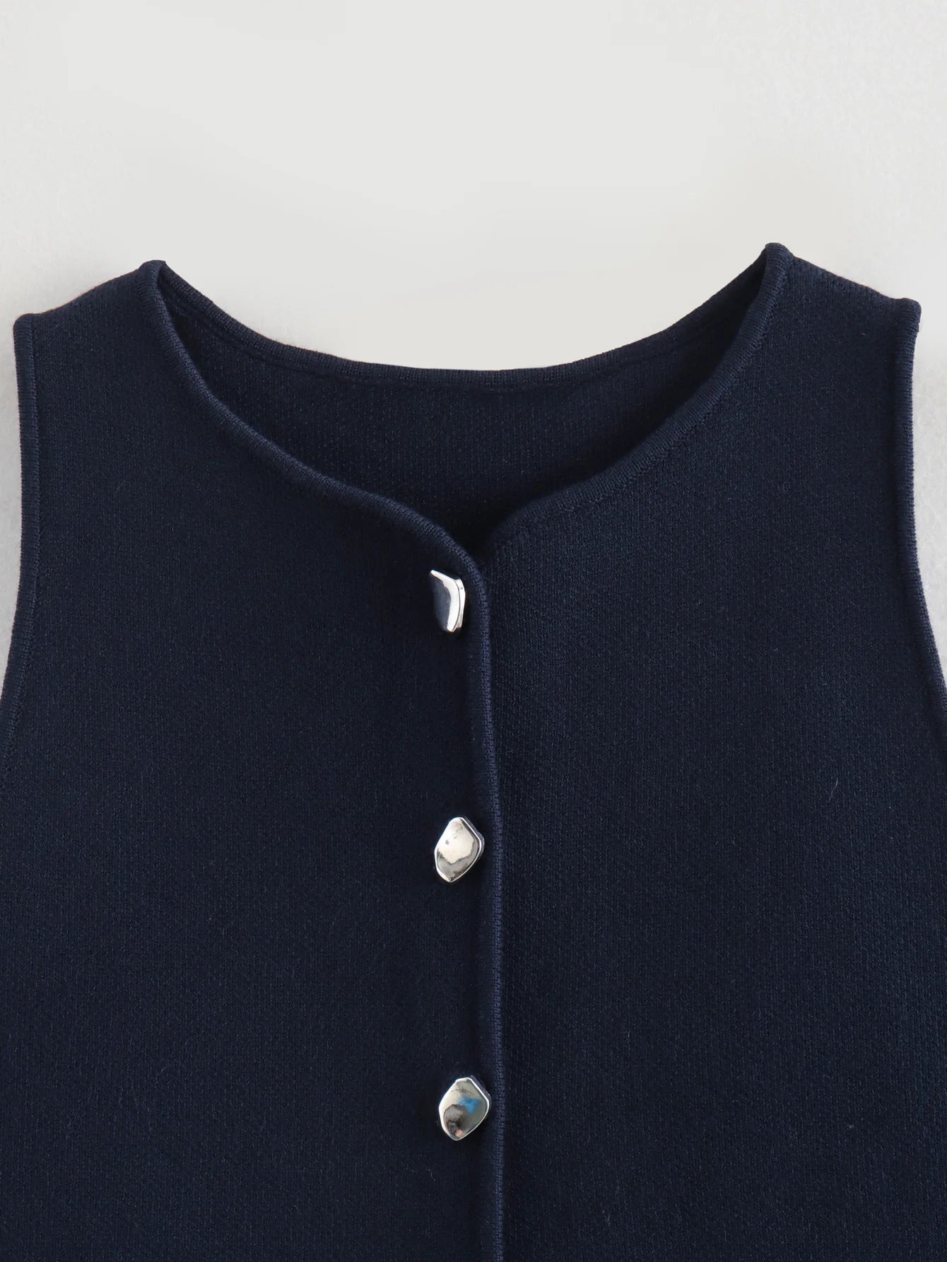 Gilet court en tricot rose sans manches pour femme