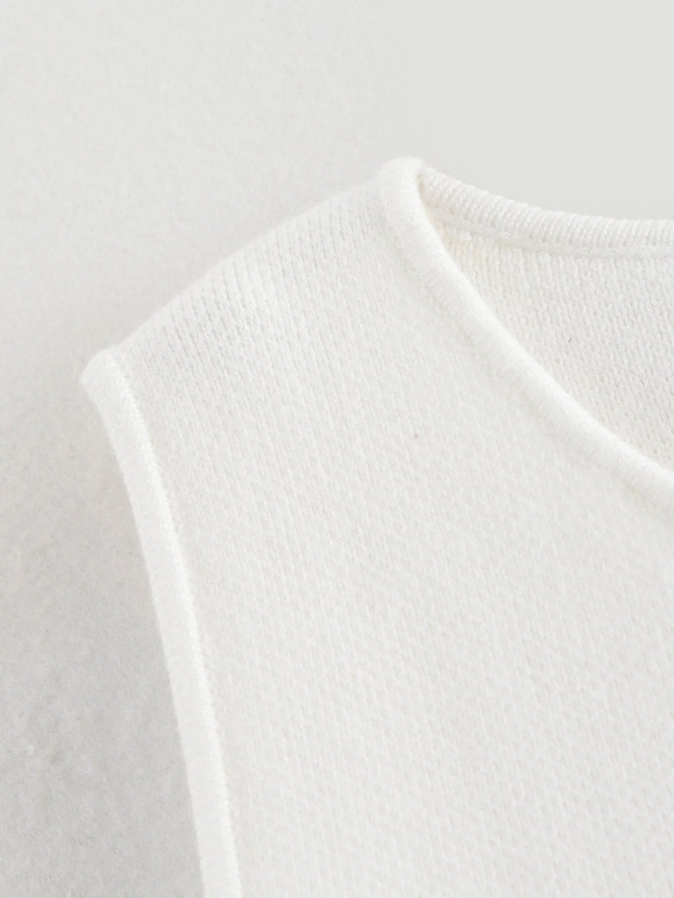 Gilet court en tricot rose sans manches pour femme